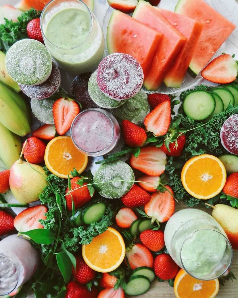 Nutes Superfood Raw Unpasteurized Frozen Smoothie pucks surrounded by fresh fruits