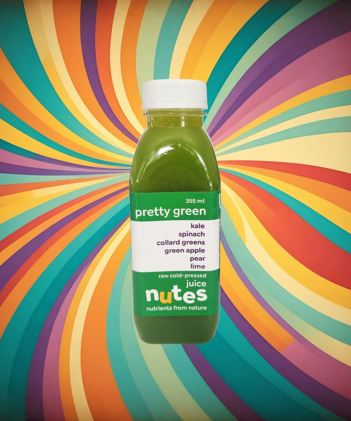 Nutes superfoods pretty green flavoured cold-pressed juice bottle with high-vibe background