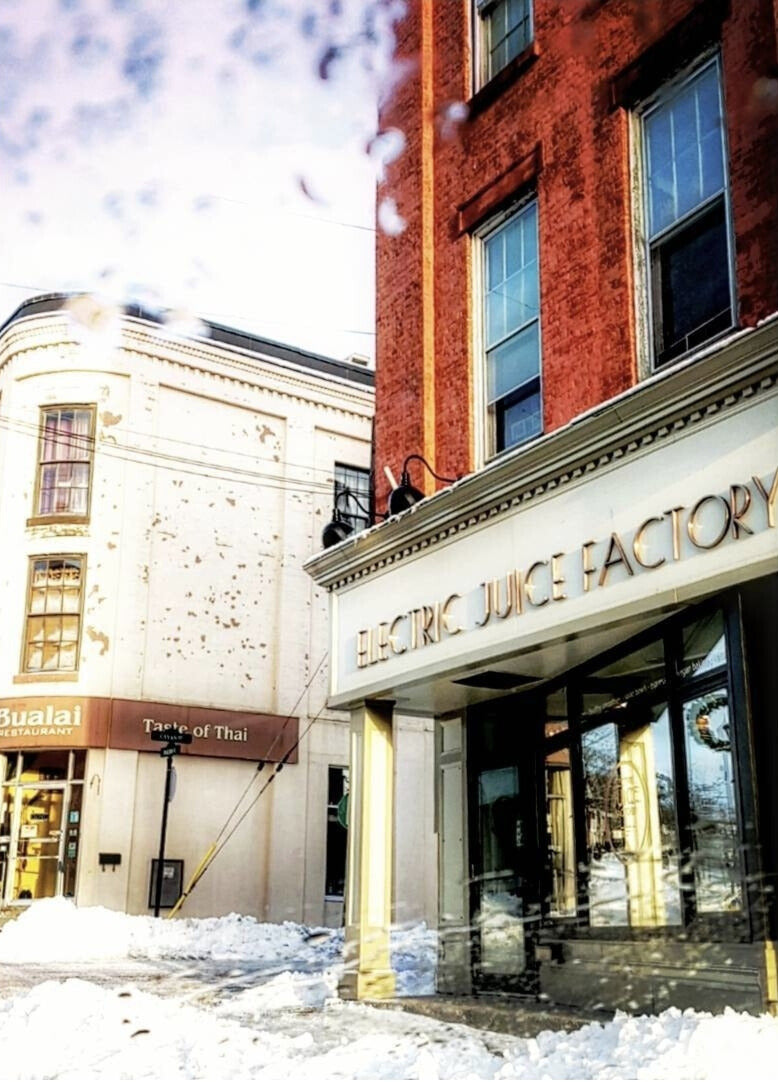 Outside of the electric juice factory building in Ontario with snow on the ground