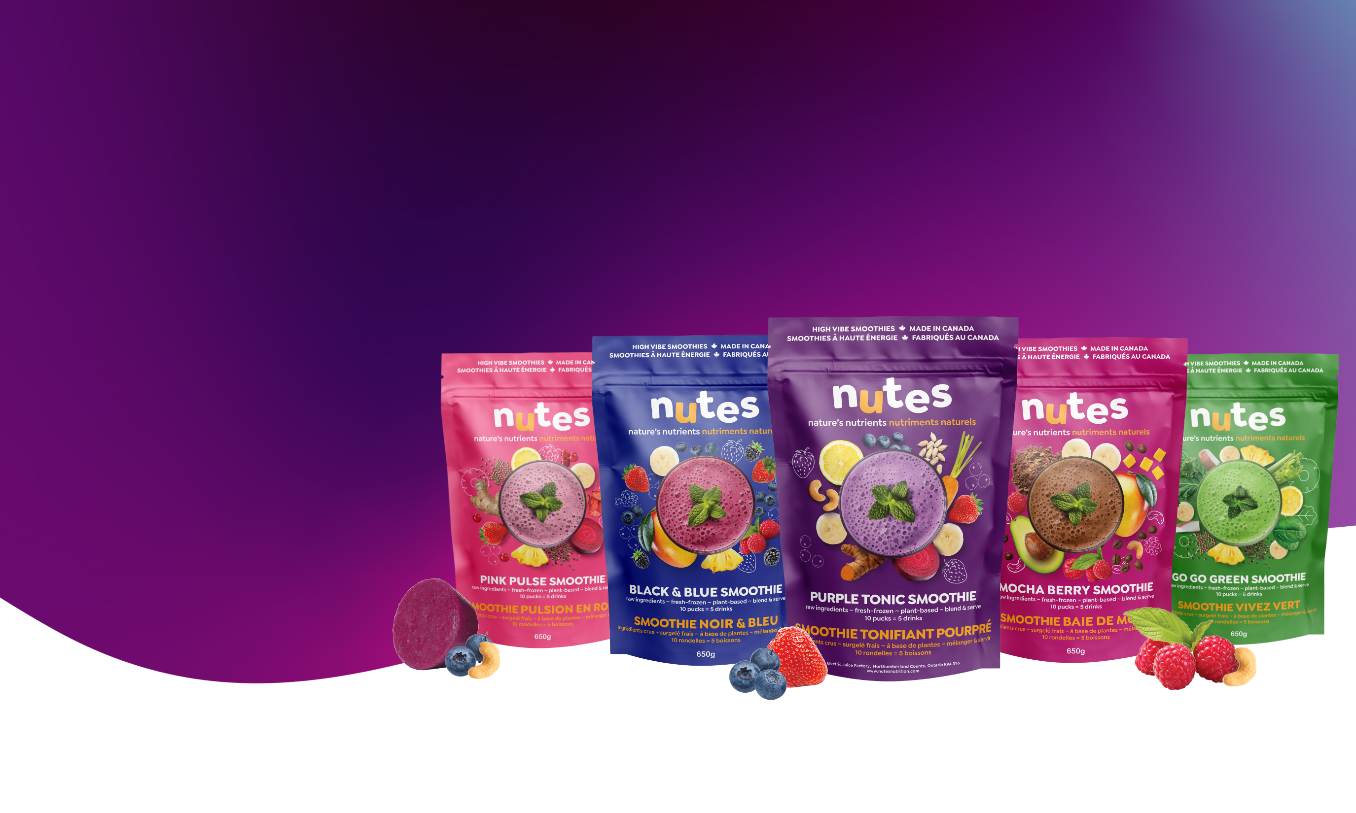 Nutes frozen superfood smoothie packages with berries and purple and pink background