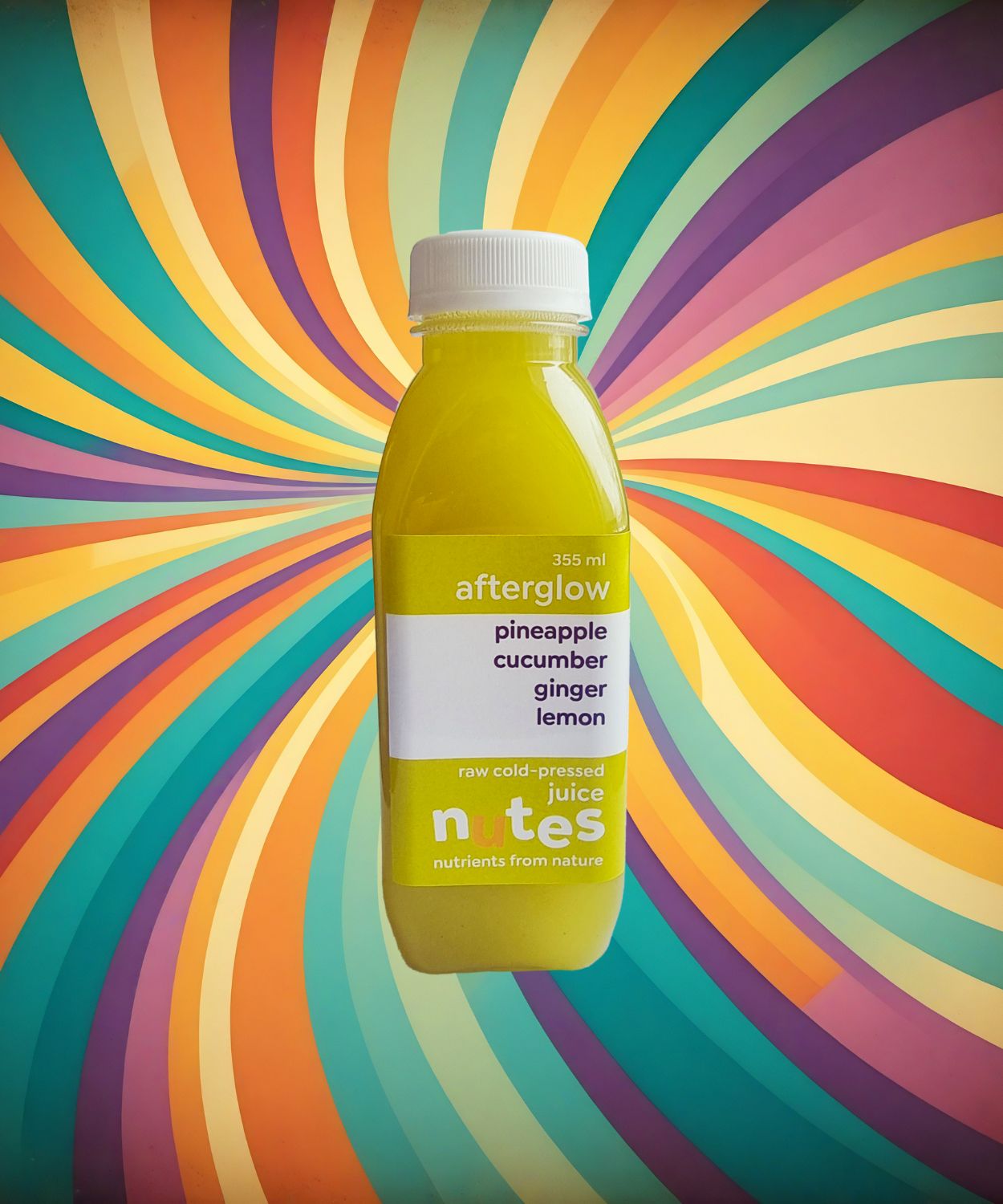 Nutes superfoods afterglow flavoured cold-pressed juice bottle with high-vibe background