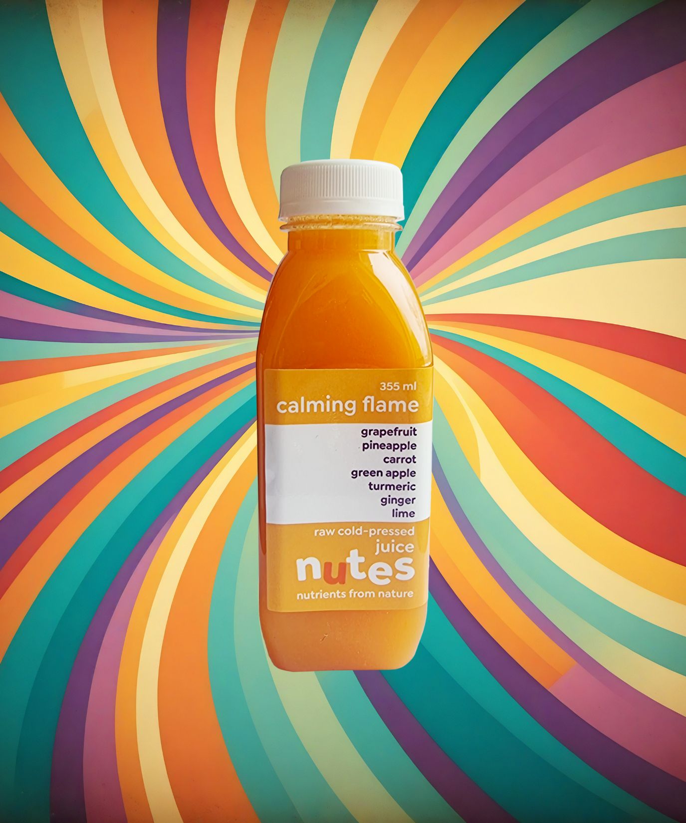 Nutes superfoods calming flame flavoured cold-pressed juice bottle with high-vibe background